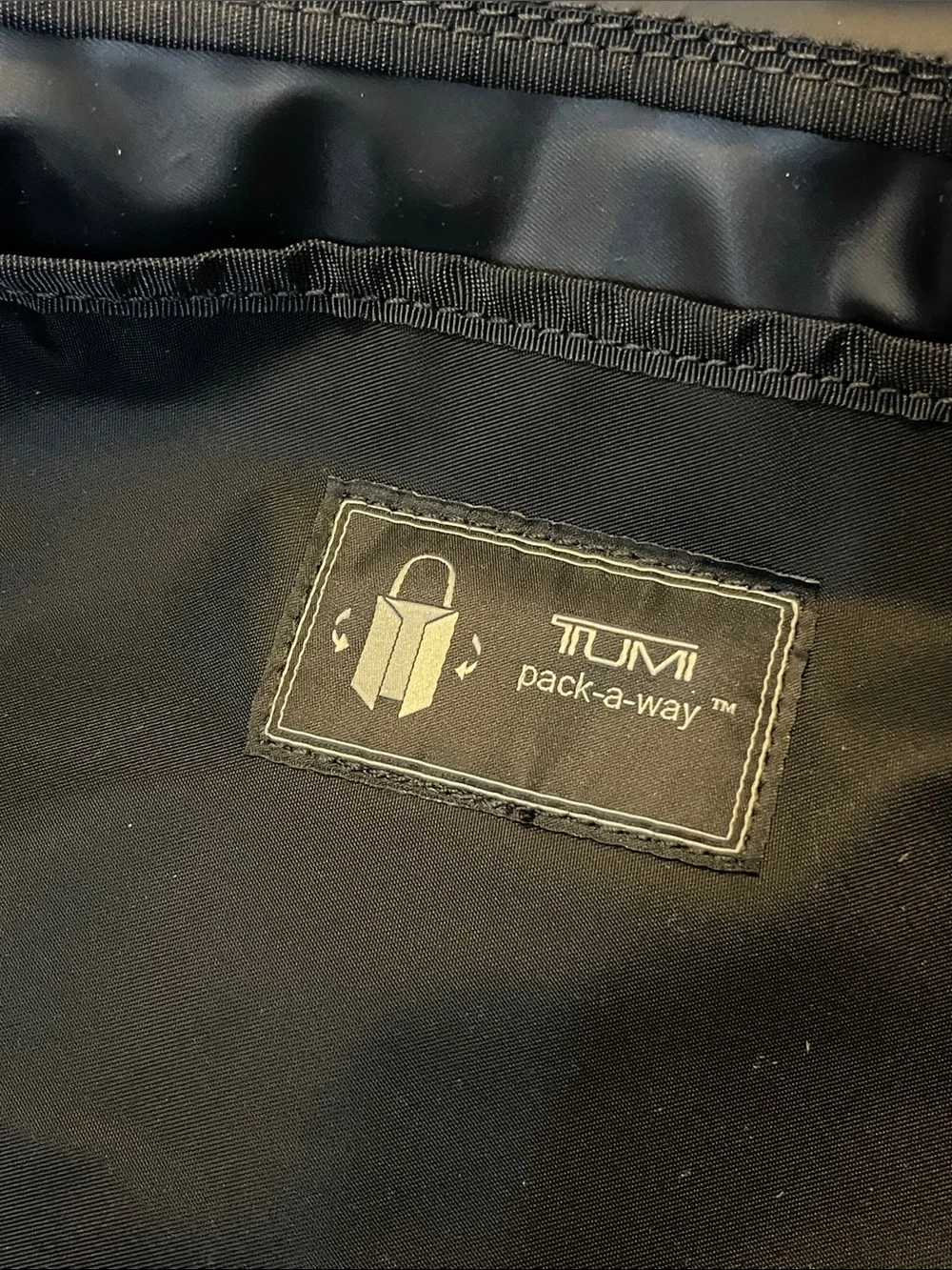 Tumi sleek black